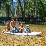 3 women and 2 men riding on boat during daytime